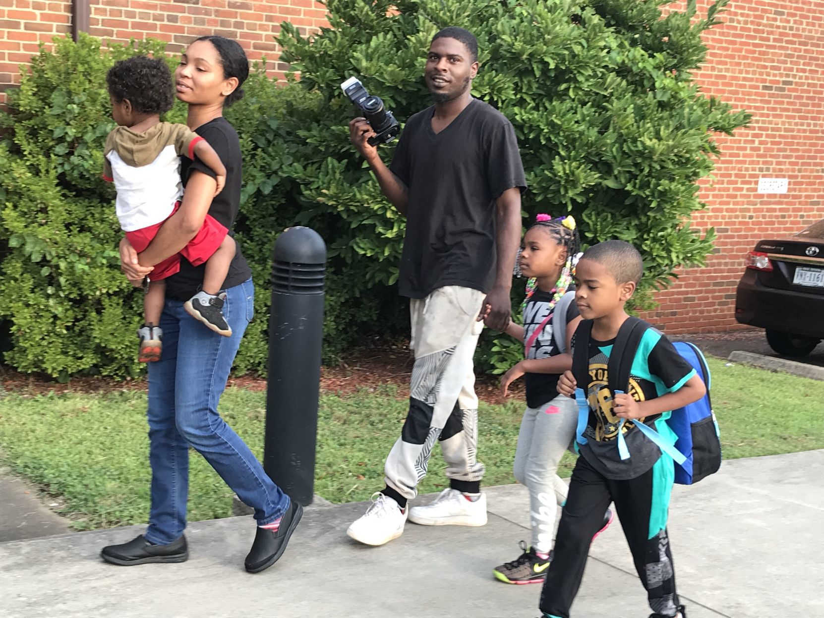 Manns family walking in